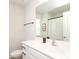 Bright bathroom showcasing a white vanity, black hardware, and a framed mirror at 7024 Jane Parks Way, Charlotte, NC 28217