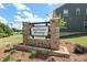 Community sign for McDowell Crossing with brick base and green grass at 7024 Jane Parks Way, Charlotte, NC 28217