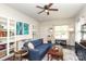 Comfortable living area with a blue sectional sofa, stylish decor, and ample natural light at 7024 Jane Parks Way, Charlotte, NC 28217
