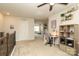 Second floor loft featuring neutral walls, ceiling fan, and built in shelves at 7024 Jane Parks Way, Charlotte, NC 28217