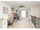 Open loft area with desks, ceiling fan, and bright natural light at 7024 Jane Parks Way, Charlotte, NC 28217