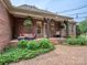 Brick patio with comfortable seating, decorative plants, and string lights for outdoor enjoyment at 705 Woburn Abbey Dr, Fort Mill, SC 29715