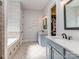 Beautiful bathroom featuring double vanities, a soaking tub, and elegant tile work at 705 Woburn Abbey Dr, Fort Mill, SC 29715