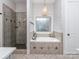 Bright bathroom features a soaking tub with tiled surround and separate shower, offering spa-like relaxation at 705 Woburn Abbey Dr, Fort Mill, SC 29715