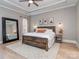 Relaxing main bedroom features a tray ceiling, neutral color palette, and abundant natural light at 705 Woburn Abbey Dr, Fort Mill, SC 29715