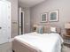 The cozy bedroom boasts warm decor, carpet floors and ample natural light at 705 Woburn Abbey Dr, Fort Mill, SC 29715