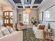 Comfortable living room with coffered ceiling, neutral tones, and a large window for natural light at 705 Woburn Abbey Dr, Fort Mill, SC 29715