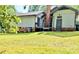 Expansive backyard featuring a lush lawn and the back of the home at 7133 Tall Tree Ln, Charlotte, NC 28214