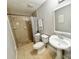 Bathroom featuring tiled shower, pedestal sink, and neutral decor at 7133 Tall Tree Ln, Charlotte, NC 28214
