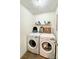 Functional laundry area with modern washer and dryer units at 7133 Tall Tree Ln, Charlotte, NC 28214
