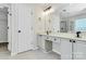 Bathroom with dual sinks, a large mirror, and a walk-in shower at 720 Reigate Rd, Charlotte, NC 28262