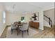 Bright dining room features hardwood floors, stylish furniture, and a modern aesthetic at 720 Reigate Rd, Charlotte, NC 28262