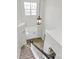 High angle view of a foyer with wood floors and a modern pendant light at 720 Reigate Rd, Charlotte, NC 28262