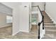 Bright foyer with wood floors and staircase leading to the second floor at 720 Reigate Rd, Charlotte, NC 28262
