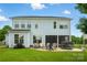 Spacious backyard featuring a patio with outdoor furniture and lush green grass at 7322 Vesper Dr, Huntersville, NC 28078