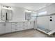 Bathroom featuring modern fixtures, a glass-enclosed shower, and white cabinetry at 7322 Vesper Dr, Huntersville, NC 28078