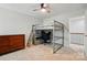 Cozy bedroom showcasing a bunk bed with a desk, neutral walls, and a ceiling fan at 7322 Vesper Dr, Huntersville, NC 28078