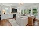 Spacious living room features a fireplace, large windows for natural light, and hardwood floors at 7322 Vesper Dr, Huntersville, NC 28078