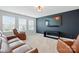 Comfortable living room with plush seating, large TV, and carpet floors at 7322 Vesper Dr, Huntersville, NC 28078