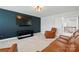 Cozy living room with plush seating, modern entertainment center, and carpet flooring at 7322 Vesper Dr, Huntersville, NC 28078