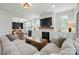 Cozy living room with a fireplace, and a view to another living space at 7322 Vesper Dr, Huntersville, NC 28078