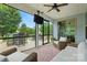 Relaxing screened porch with outdoor seating and views of the backyard at 7322 Vesper Dr, Huntersville, NC 28078