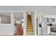 View of stairs and kitchen area with stainless steel refrigerator at 8139 Deodora Cedar Ln, Charlotte, NC 28215