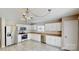 Well-lit kitchen with white cabinets and stainless steel appliances at 8139 Deodora Cedar Ln, Charlotte, NC 28215