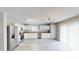 Bright kitchen with white cabinets, tile flooring, and stainless-steel appliances at 8139 Deodora Cedar Ln, Charlotte, NC 28215