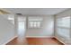 Bright living room with hardwood floors and an open layout to other rooms, perfect for entertaining at 8139 Deodora Cedar Ln, Charlotte, NC 28215