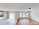 Inviting living room featuring wood flooring and sliding glass doors for natural light and easy outdoor access at 8139 Deodora Cedar Ln, Charlotte, NC 28215