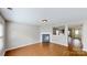Living room featuring a fireplace and an open view to other rooms at 8139 Deodora Cedar Ln, Charlotte, NC 28215