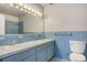 Vintage bathroom with double vanity, blue tiling, and classic fixtures at 841 12Th Nw Ave, Hickory, NC 28601