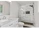 This bathroom features a sleek glass shower, marble tiles, modern fixtures, and natural light at 841 12Th Nw Ave, Hickory, NC 28601