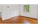 This bedroom features hardwood floors, a window with a view, and a closet at 841 12Th Nw Ave, Hickory, NC 28601