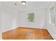 This bedroom has hardwood floors, a window, and natural light at 841 12Th Nw Ave, Hickory, NC 28601