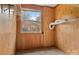 Walk-in closet with window view, built-in shelving, and wood paneling at 841 12Th Nw Ave, Hickory, NC 28601