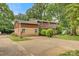 Inviting two-story home with brick and wood panel exterior and an extended driveway at 841 12Th Nw Ave, Hickory, NC 28601