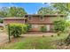 Charming two-story home with wood panel exterior, lush landscaping, and a welcoming entrance at 841 12Th Nw Ave, Hickory, NC 28601