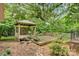 Beautiful backyard gazebo and deck surrounded by mature trees and landscaping at 841 12Th Nw Ave, Hickory, NC 28601