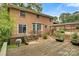 Rear exterior view featuring a wooden deck, brick facade, and covered outdoor space at 841 12Th Nw Ave, Hickory, NC 28601