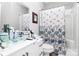 Bathroom featuring modern vanity with bowl sink and colorful shower curtain at 9011 Kensington Forest Dr, Harrisburg, NC 28075