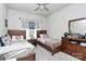 Cozy bedroom featuring two twin beds, soft carpet, and a dresser at 9011 Kensington Forest Dr, Harrisburg, NC 28075