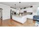 Modern kitchen with stainless steel appliances and a spacious center island with granite countertops at 9011 Kensington Forest Dr, Harrisburg, NC 28075