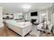 Spacious living room with hardwood floors, fireplace, and open layout with lots of light at 9011 Kensington Forest Dr, Harrisburg, NC 28075