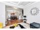 Open concept living and dining room featuring hardwood floors and elegant decor at 9011 Kensington Forest Dr, Harrisburg, NC 28075