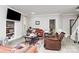 Comfortable living room featuring modern decor, a television, and an open floor plan at 9011 Kensington Forest Dr, Harrisburg, NC 28075