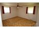 Bedroom with ceiling fan and two windows at 908 Ravendale Dr, Charlotte, NC 28216