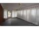 Enclosed sunroom with multiple windows providing natural light at 908 Ravendale Dr, Charlotte, NC 28216