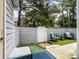 Private outdoor space with a patio seating area and a white privacy fence at 9121 Kings Canyon Dr, Charlotte, NC 28210